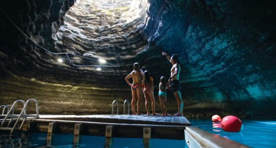 Group of people standing on the dock in the Crater