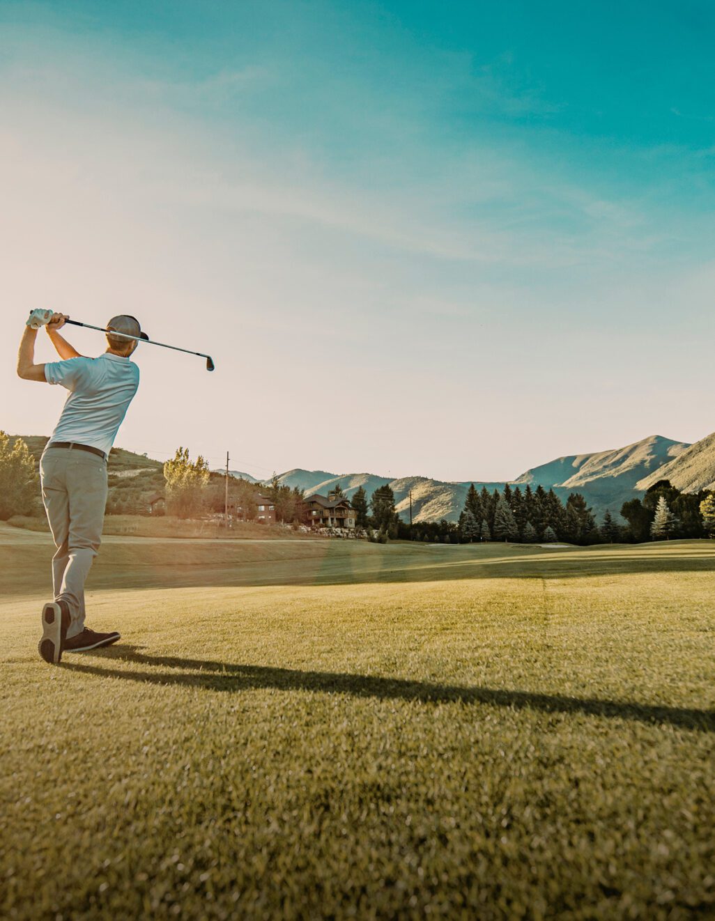 Golfer is taking a swing