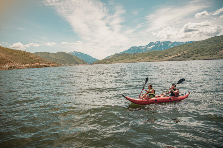 Two people in the red canoe on the water