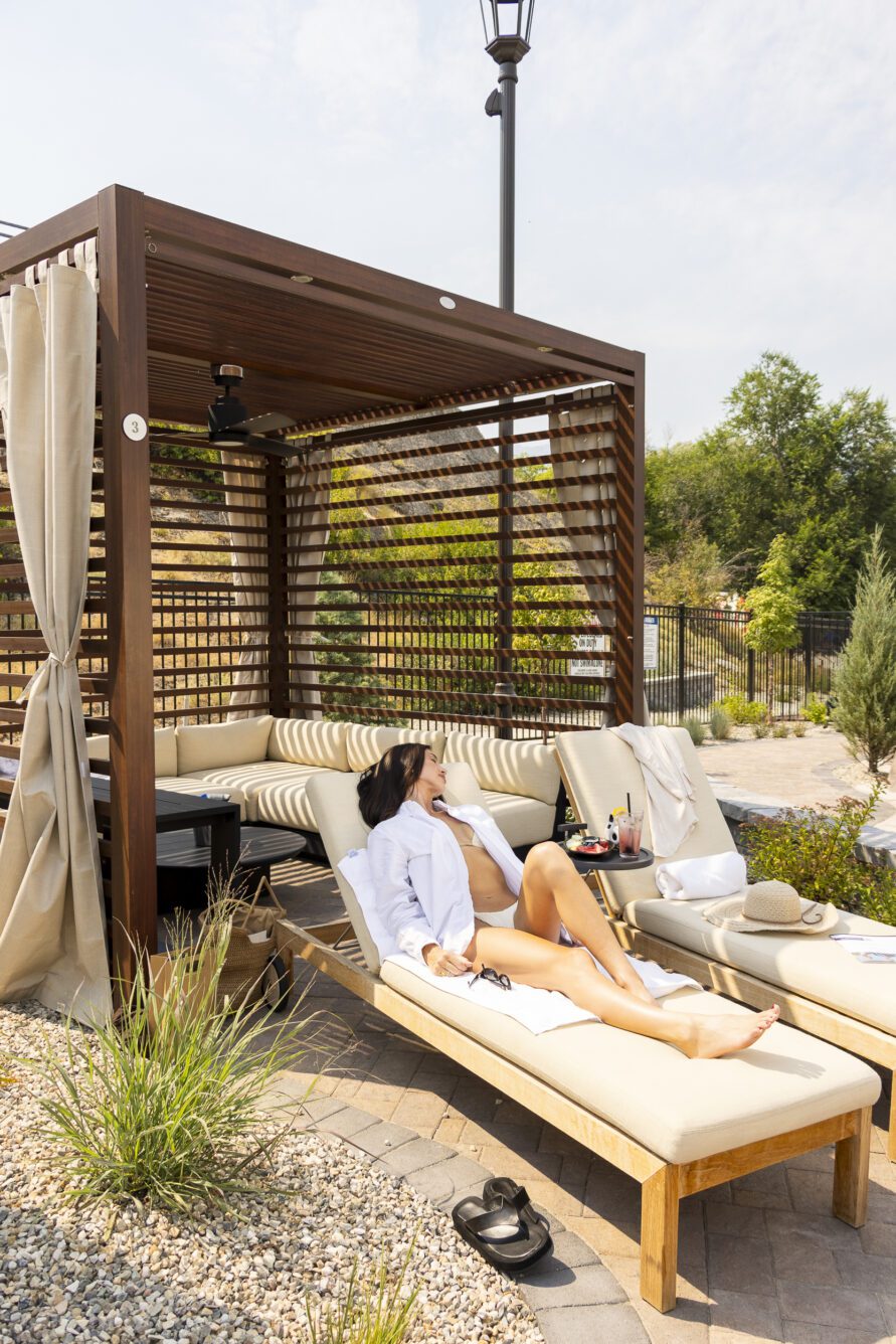 Woman lounging in the cabana chair