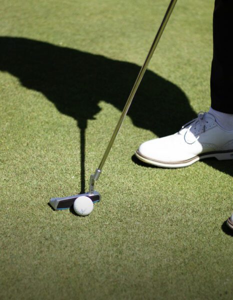 Golf stick touching the ball