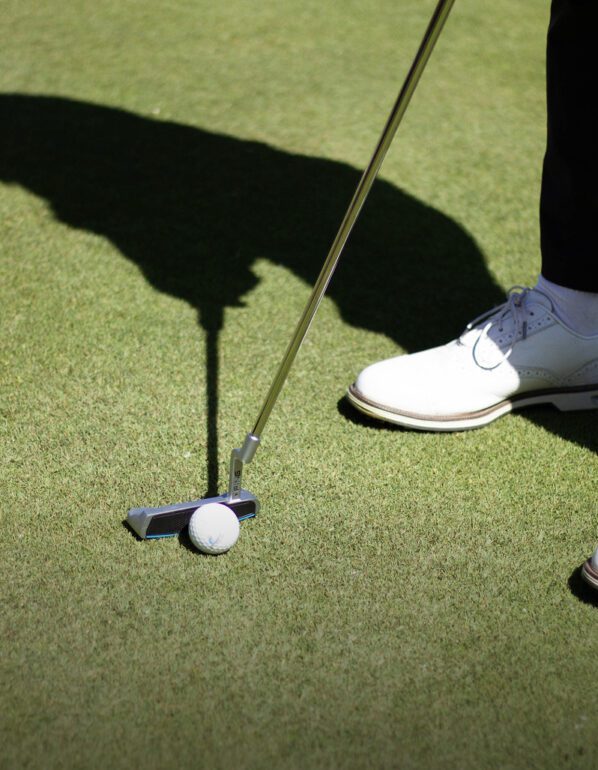 Golf stick touching the ball