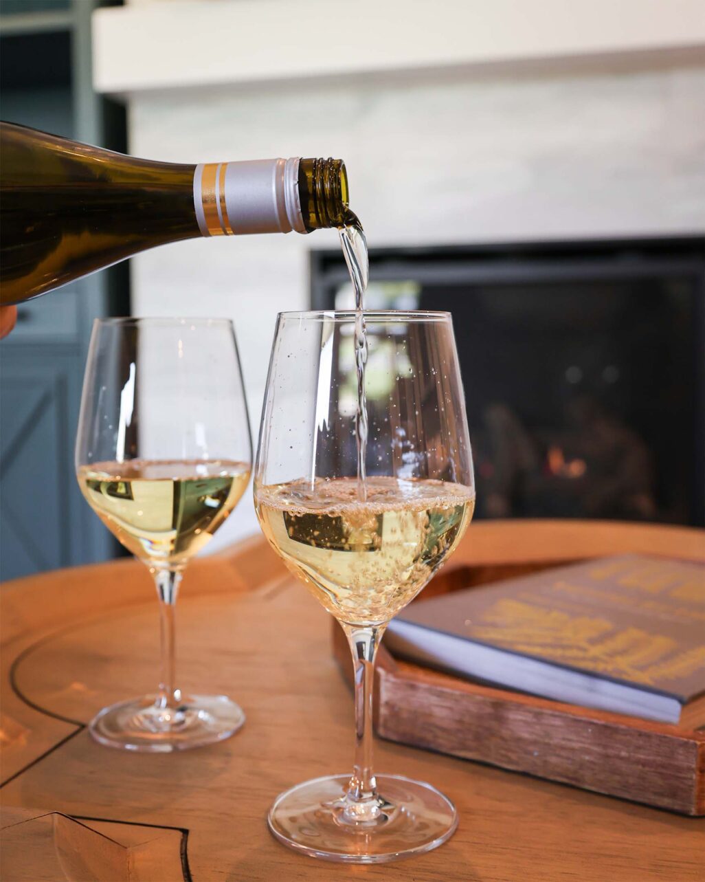 Pouring sparkling wine within guest accommodations at Homestead Midway Utah