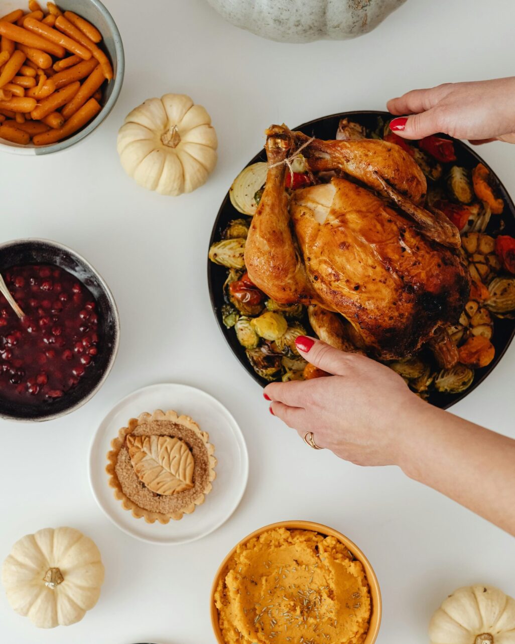 Person setting down turkey for Thanksiving