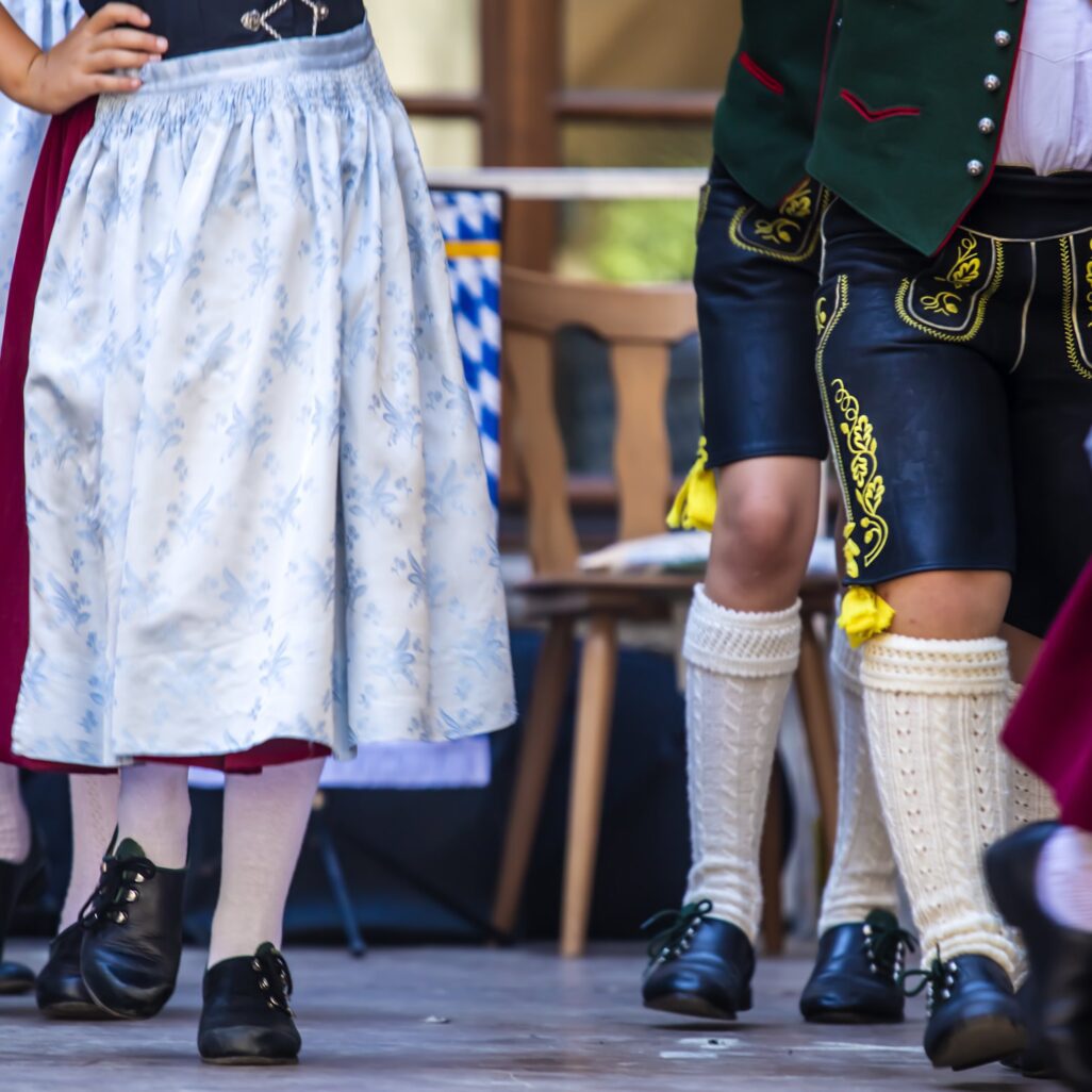 People in traditional costume and dance during festival