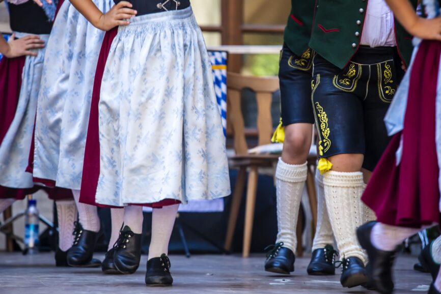 People in traditional costume and dance during festival