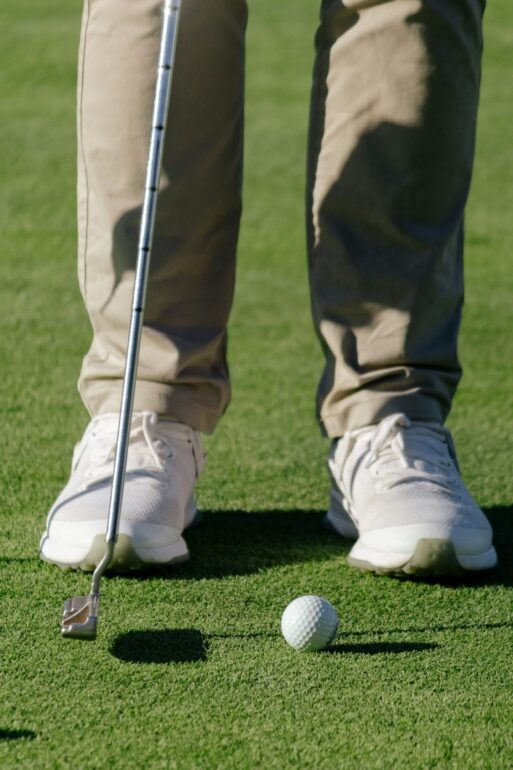Stock image of golfer putting on the green